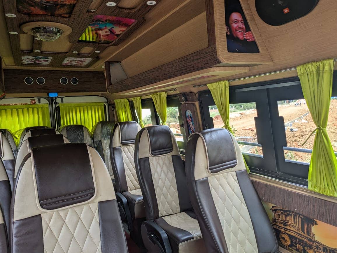 Rows of seats inside a Tempo Traveller