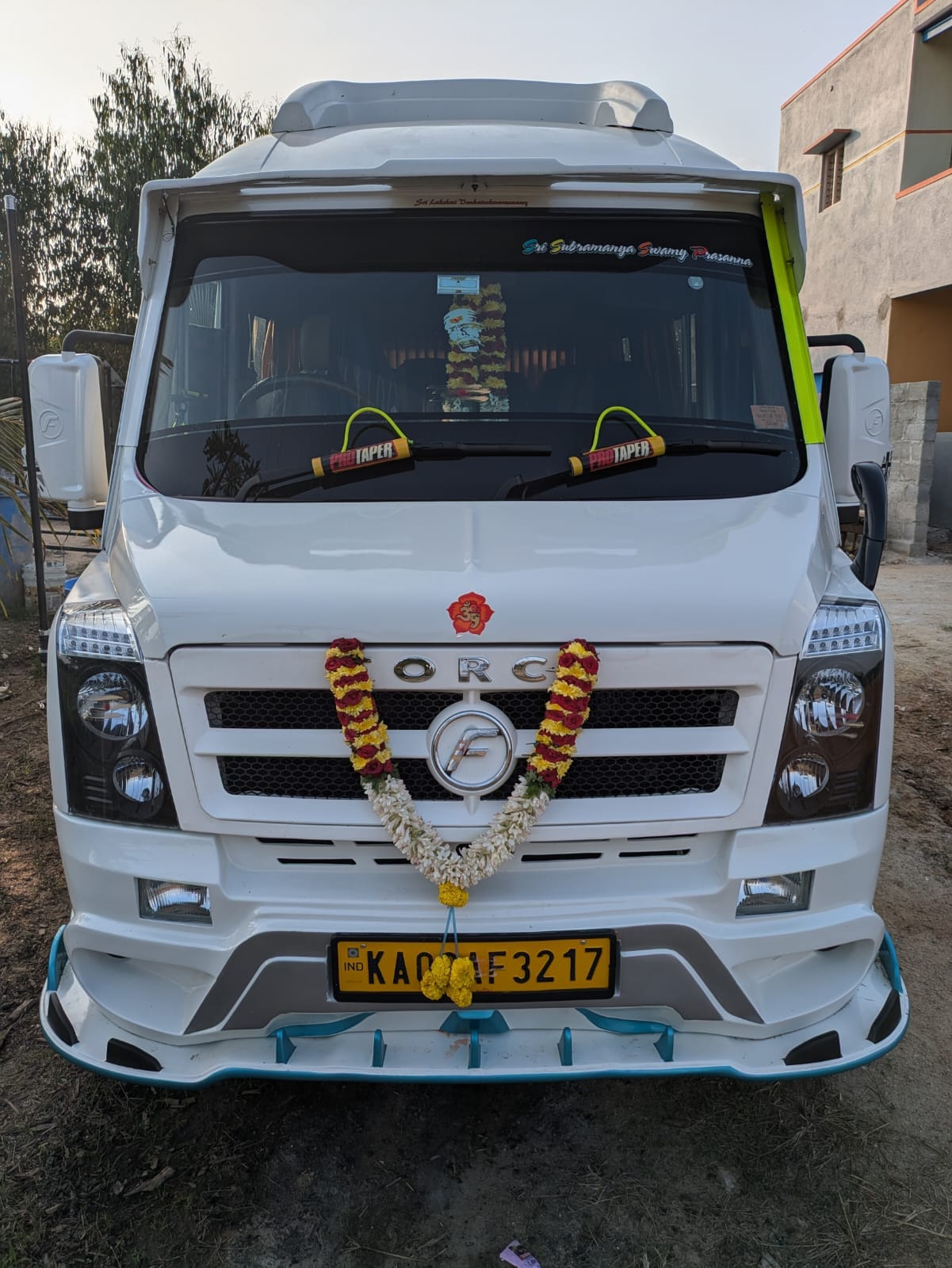A tour group with their Tempo Traveller